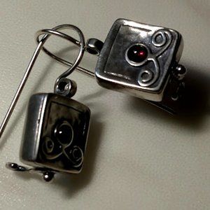 Ornate sterling earrings With tiny purple stone.